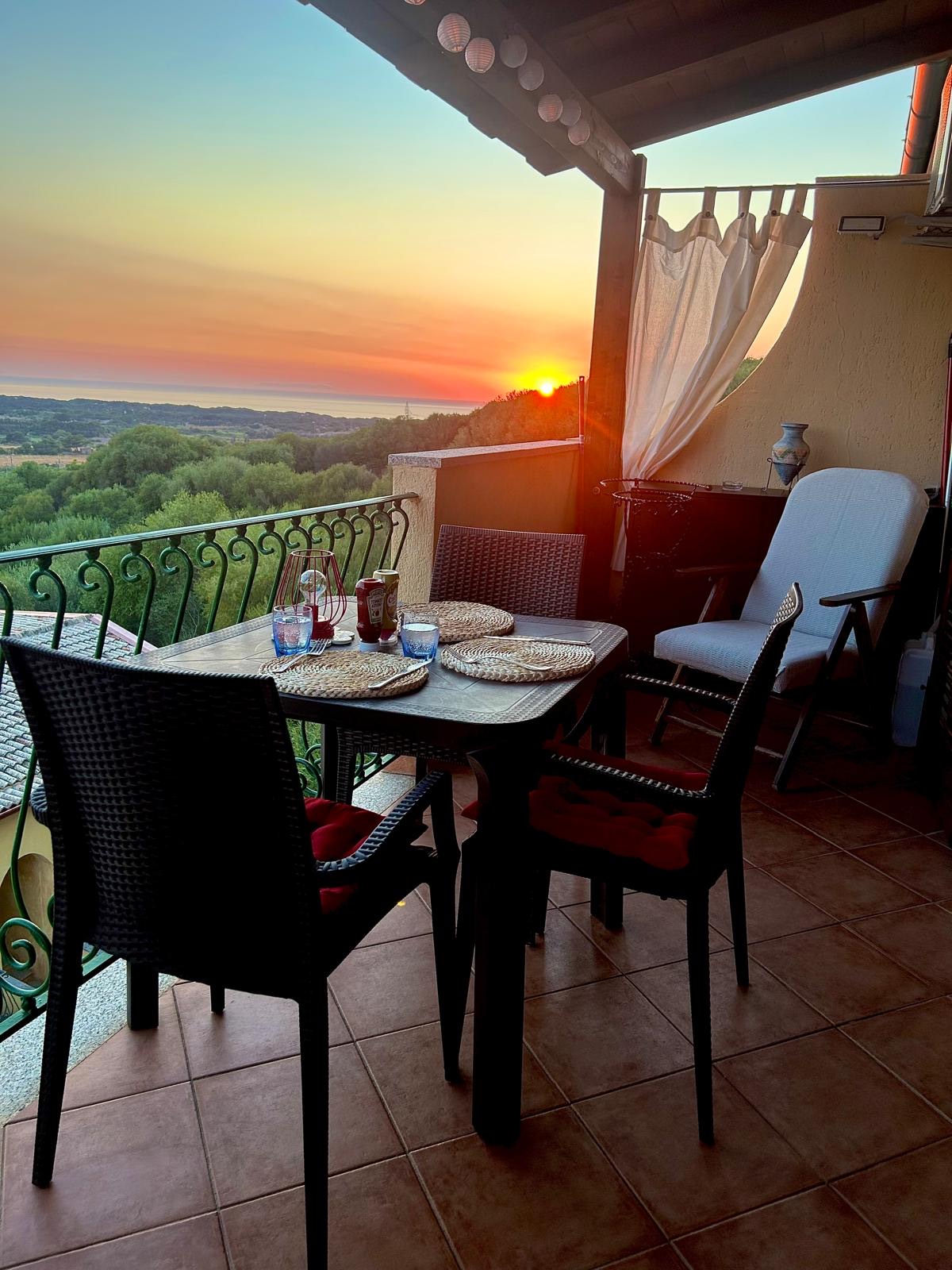 The veranda at sunset, table set for dinner