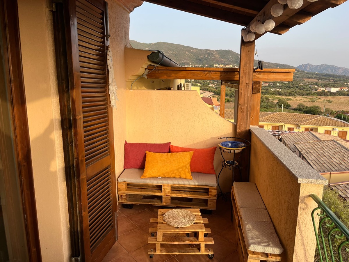 Shaded lounge corner with a view over the rooftops